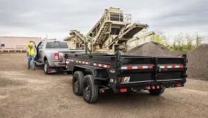 Worker stepping out of a truck hauling the 83