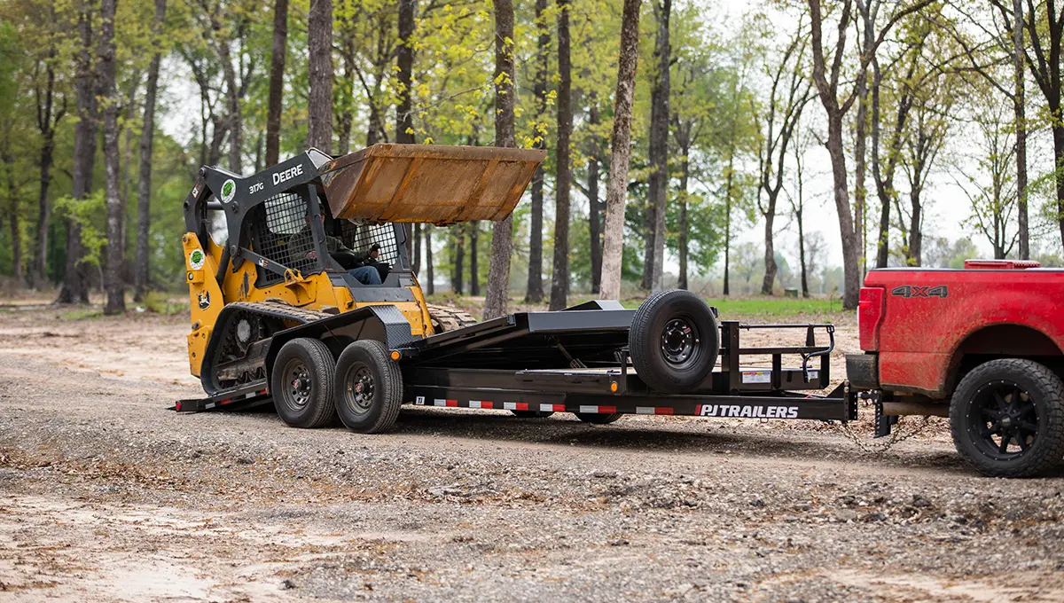 Loading a John Deere skid loader onto the HD Equipment Tilt 6